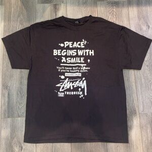 Stussy Black Graphic Tee - Peace Begins With a Smile